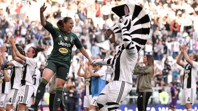 Juventus' Italian goalkeeper Laura Giuliani and the Juventus mascot celebrate after the club created an Italian club attendance record of 39,027 at Juventus Stadium in Turin last Sunday. Picture: AFP