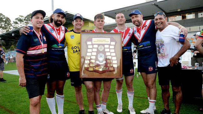 2024 Nambucca players and their fathers, who won the 1996 grand final. From left to right: Warwick Jones, Tyronne Roberts-Davis, Geoff Batten, Toby Batten, Logan Jones, Greg Davis, Brett Davis. Picture: Leigh Jensen