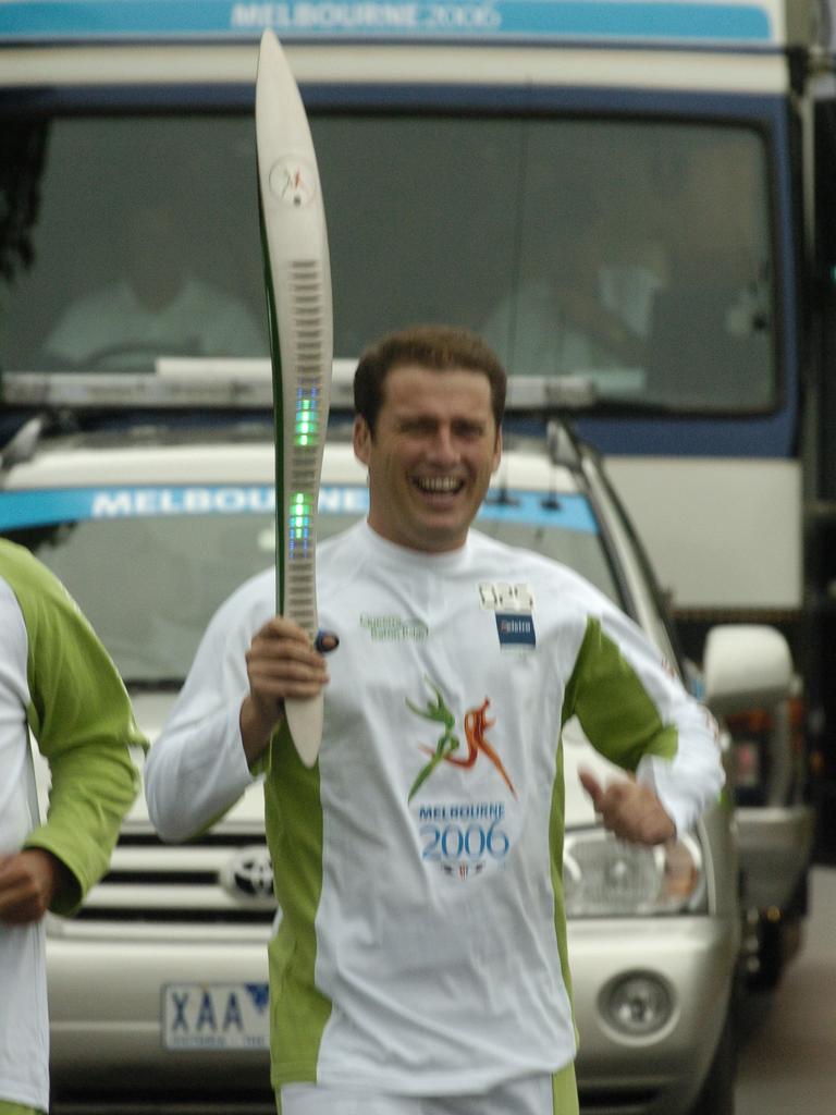 Stefanovic with the baton for the Queen’s Baton Relay for the 2006 Commonwealth Games in Melbourne. 