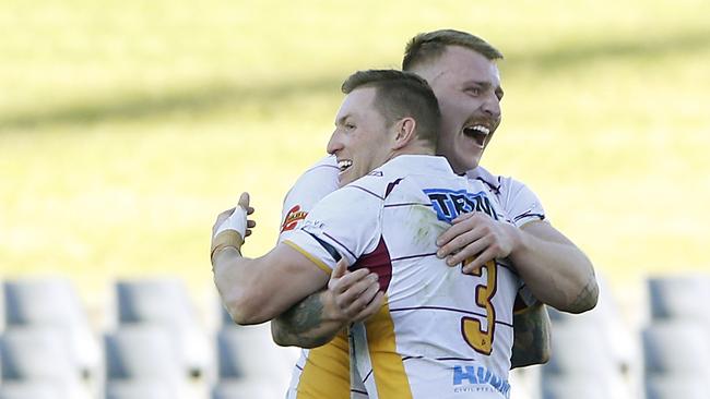 Thirlmere’s Matt Scott and Josh Bryant (No.3) after the hooter sounds. Picture: John Appleyard