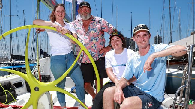 Richard Grimes, preparing for the Sydney to Hobart yacht race, with his children, Tom and Jess, 23, and Rebecca, 26, on Hasta La Vista. Pic: Justin Lloyd.