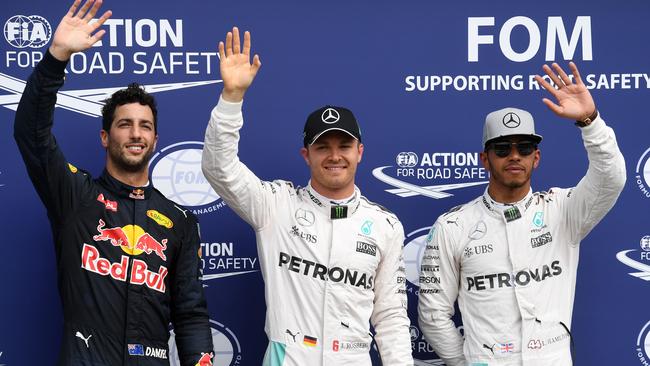 Daniel Ricciardo, Nico Rosberg and Lewis Hamilton wave on the podium at the Hockenheim circuit.