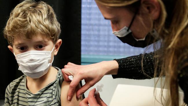 A child is vaccinated against Covid in Paris this week. Picture: AFP