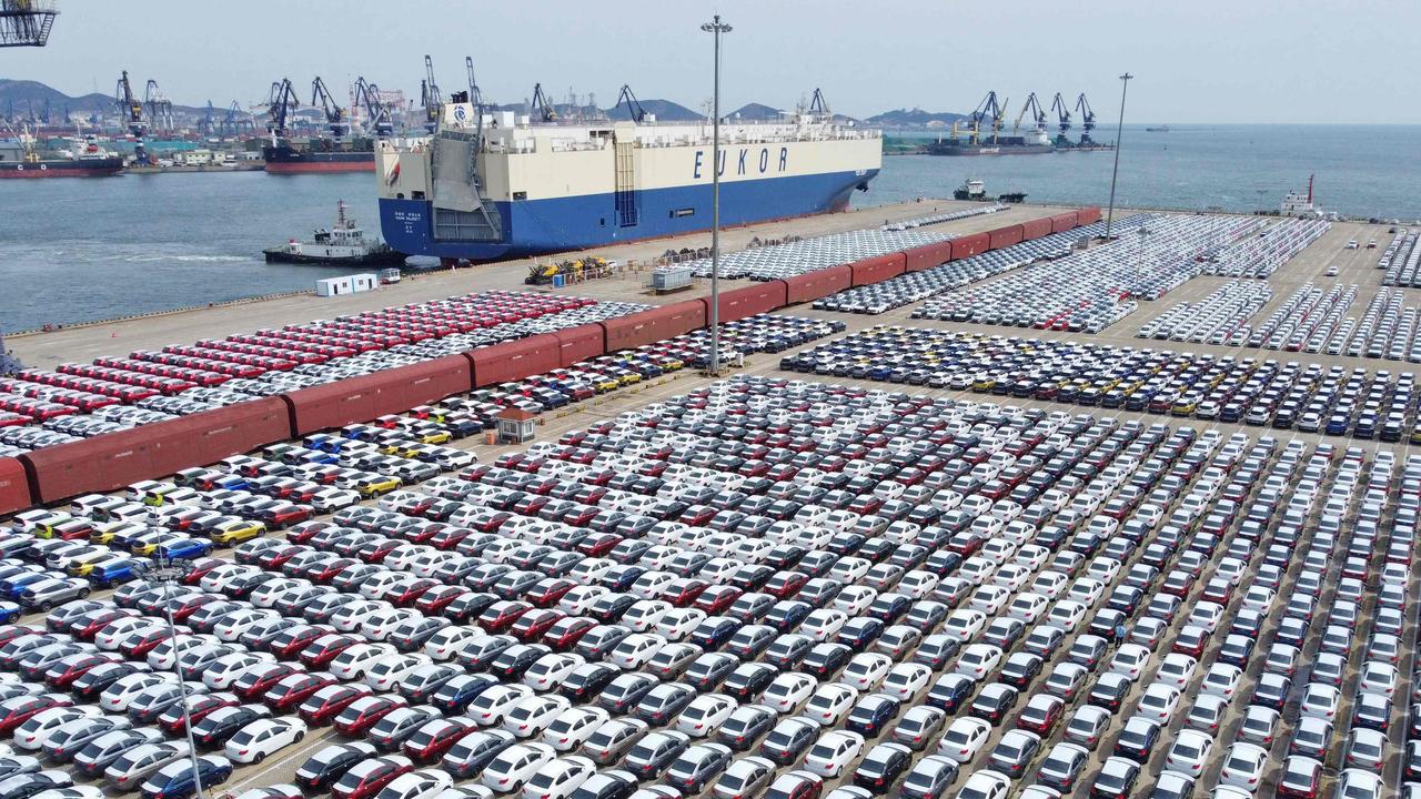 Cars wait to be exported from Yantai port in China’s eastern Shandong province. Picture: AFP