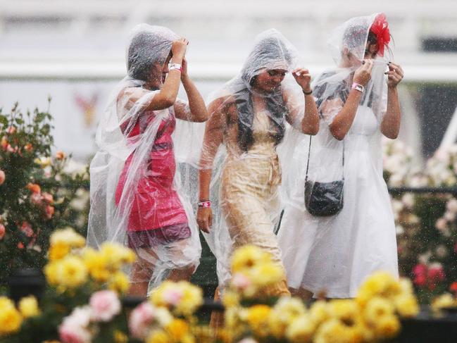 File: Racegoers endure the wet conditions during Melbourne Cup Day. Photo: Michael Dodge/Getty Images.