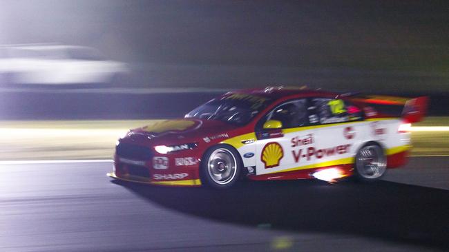 Fabian Coulthard’s Falcon shoots flame during Supercars’ light testing.