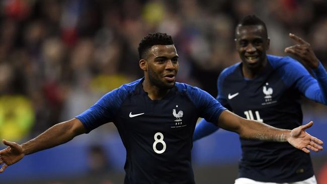 France's midfielder Thomas Lemar celebrates with teammates after scoring a goal