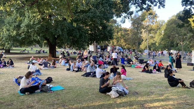 Many more Swift superfans set up for a picnic on the grass next to Jolimont Terrace. Picture: Angus McIntyre