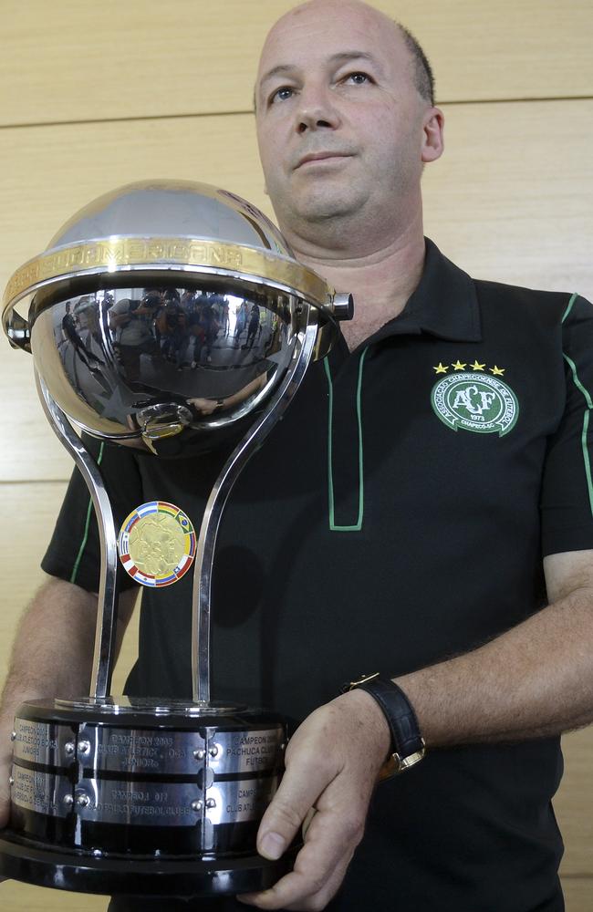 The director of Brazil's Chapecoense football club, Marcelo Zolet, holds a replica of a Copa Sudamericana trophy, sent by the president of Colombia's Independiente Santa Fe, Cesar Pastrana as a tribute. Picture: Raul Arboleda.