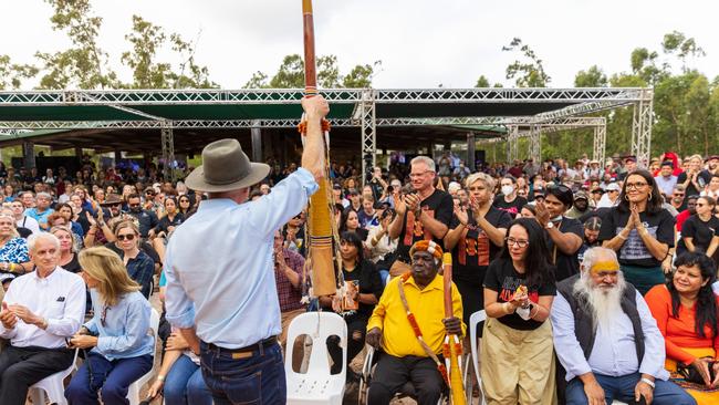 Prime Minister of Australia Anthony Albanese holds a Didgeridoo (Yidaki) in front of the crowd during Garma Festival. Picture: Tamati Smith/Getty Images