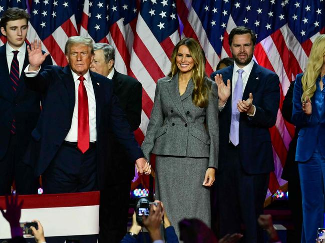 Former US President and Republican presidential candidate Donald Trump, former US First Lady Melania Trump, Barron Trump, Viktor Knavs, Republican vice presidential candidate J.D. Vance, Ivanka Trump leave at the conclusion of an election night event at the West Palm Beach Convention Center in West Palm Beach, Florida, early on November 6, 2024. (Photo by Jim WATSON / AFP)