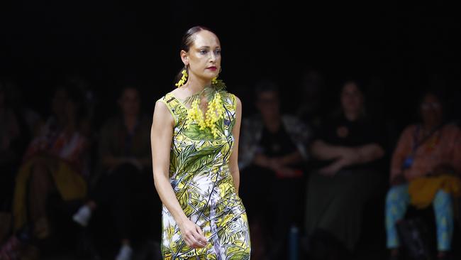 Tanika Parker showcases the Green Love collection from designer Bernard Singleton at the Cairns Indigenous Art Fair fashion performance, Woven, held at the Tanks Arts Centre, Edge Hill. Picture: Brendan Radke