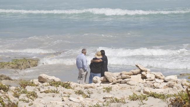 The Parents of Dan Cojocea at Mary Ellis Beach, where Dan has gone missing in the water. Picture: Robert Lang