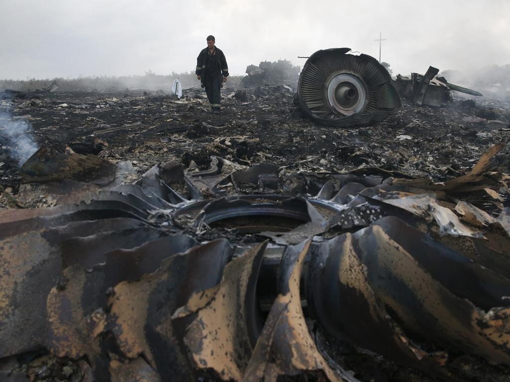 An Emergencies Ministry member at the crash site. Picture: Reuters