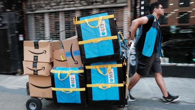 An Amazon worker moves boxes on Amazon Prime Day on July 11. Picture: Getty Images