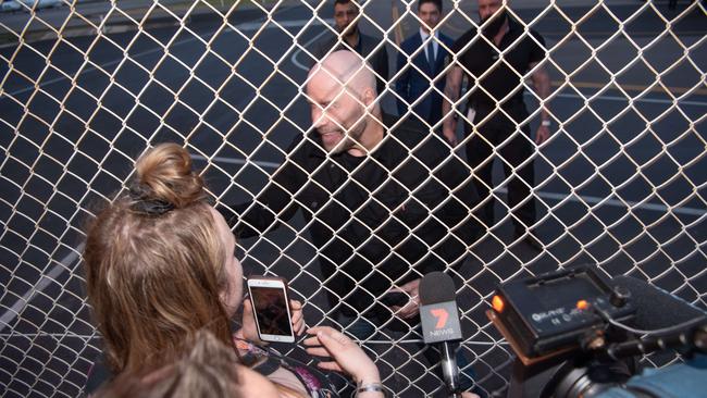 Fan Tiana Joy meets John Travolta after he arrived at Adelaide Airport on a private jet to appear at Supanova. Picture: Brad Fleet