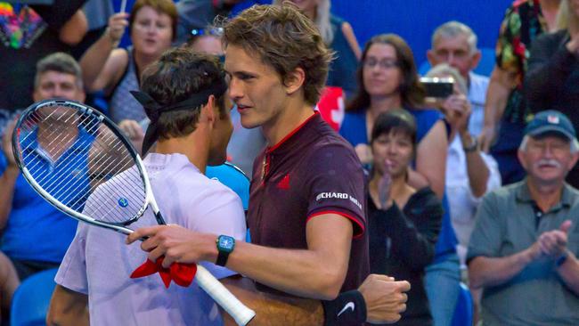 Alexander Zverev and Roger Federer after a match at the Hopman Cup. Photo: Tony Ashby (AFP)