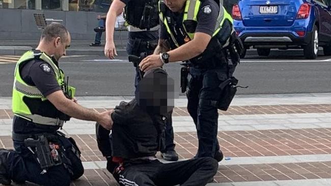 Police restrain a teen in Dandenong after he verbally abused a female police officer.