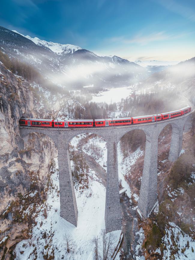 Red train over the Landwasser Viaduct.