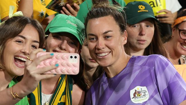 PERTH, AUSTRALIA - NOVEMBER 01: Mackenzie Arnold of Australia poses for photos with fans following the AFC Women's Asian Olympic Qualifier match between Australia and Chinese Taipei at HBF Park at HBF Park on November 01, 2023 in Perth, Australia. (Photo by Paul Kane/Getty Images)