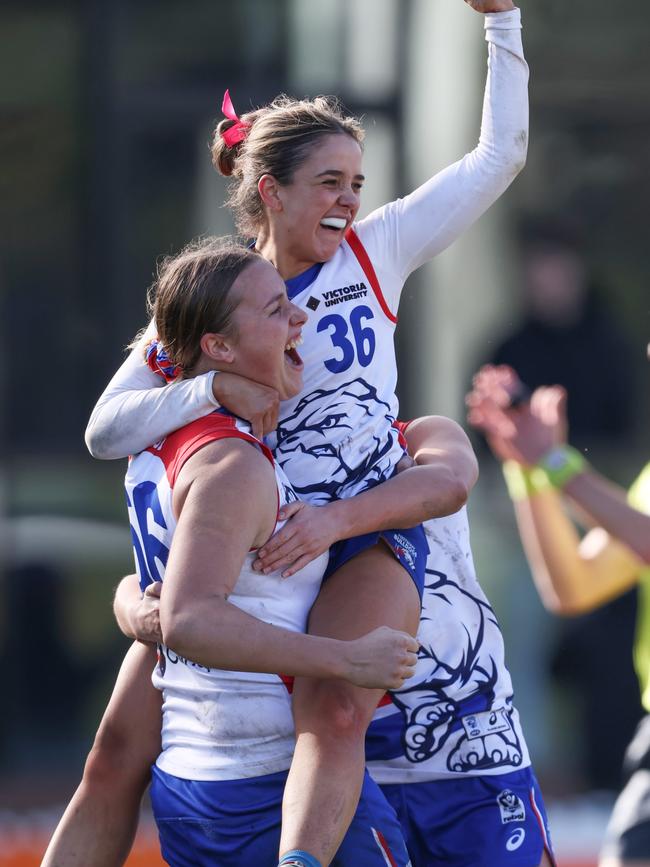 Bulldogs players celebrate a goal. (Photo by Rob Lawson/AFL Photos)