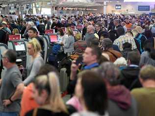 Huge queues at Sydney Airports T2 Domestic Terminal as passengers are subjected to increased security, Sydney, Australia, Monday, July 31, 2017. Airline passengers are experiencing long delays at Australian airports as security is beefed up following a number of terror raids over the weekend. Picture: DEAN LEWINS