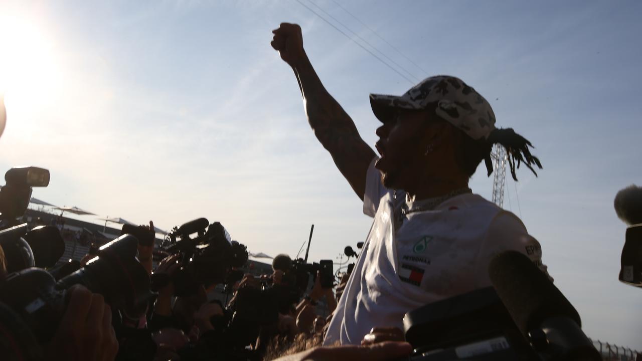 World champion Lewis Hamilton celebrates after the race in Austin. Picture: Charles Coates