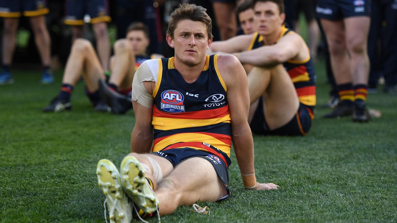 Matt Crouch of the Crows reacts after losing the AFL grand final.