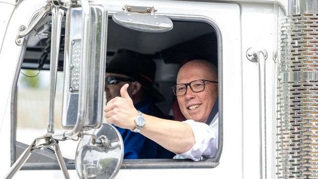 Peter Dutton hitches a ride on a petrol tanker ahead of his appearance at a petrol station in Adelaide on Monday. Picture: Thomas Lisson / NewsWire