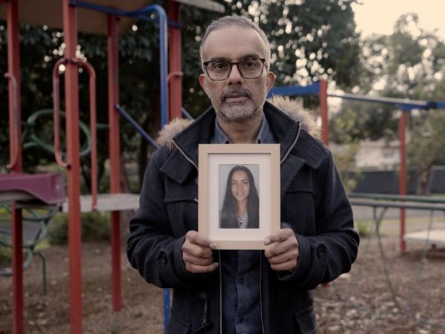 Raj Wilson holding a photo of his daughter Yasmin, who died to suicide in 2019.