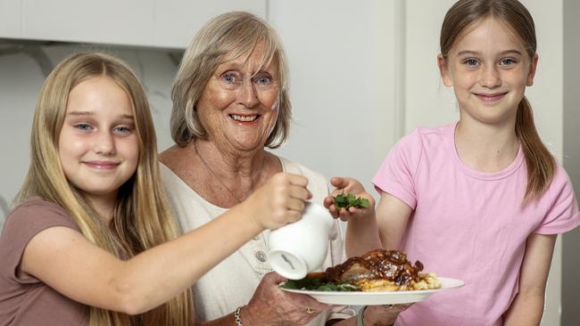 Lamb shanks is now back on the menu for Sheila and her granddaughters Phoebe, 11 and Felicity, 8, as Coles drops prices on a selection of meats. Photo by Martin Keep/Coles