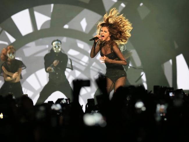 The cameras are flashing as Selena Gomez’s hair takes to the roof at her sold-out concert at the Qudos Bank Arena in Sydney Olympic Park. Picture: Christian Gilles