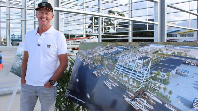 Tony Longhurst in front of the planned designs.