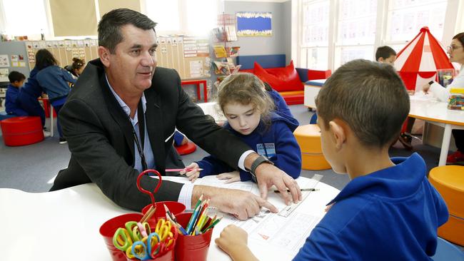 Mr Jackman helps students Nevaeh and Brooklyn. Picture: John Appleyard