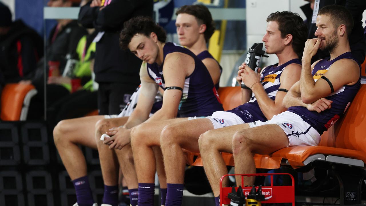 Dockers players look dejected. Photo by Mark Metcalfe/AFL Photos/via Getty Images.