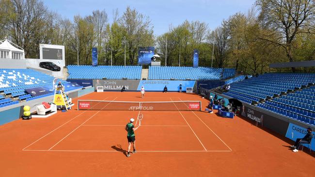 John Millman, pictured warming up in Munich in an event played without fans this week, is into the quarter-finals of the event in Germany. Picture: AFP.