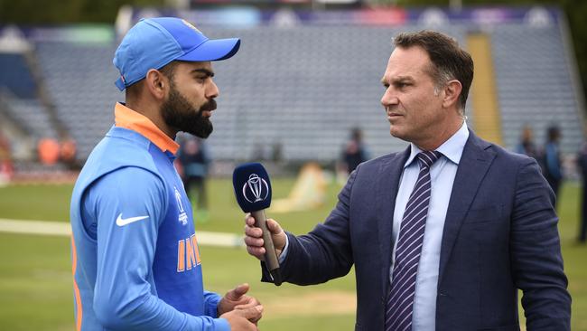 Michael Slater speaks with Indian captain Virat Kohli. Photo by Stu Forster-ICC/ICC via Getty Images