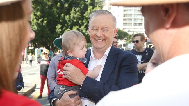 Federal opposition leader Anthony Albanese holds baby Oshy at the Labor day march in Brisbane. Picture: NCA NewsWire/Jono Searle