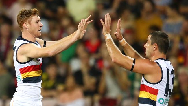 Tom Lynch celebrates a goal with co-captain Taylor Walker. Picture: Scott Barbour/Getty Images