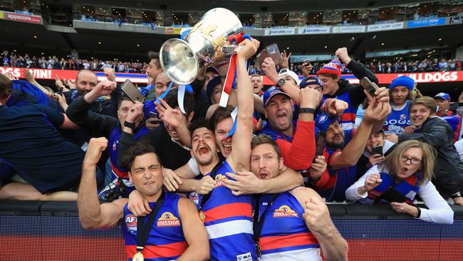 Luke Dahlhaus, Tom Liberatore and Matthew Boyd celebrate with the cup Picture: Alex Coppel.