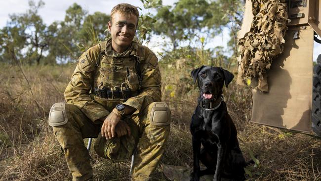 Australian Army soldier Sapper Flynn Skerke-Irwin and Explosive Detection Dog Ethan from 3rd Combat Engineer Regiment during Exercise Brolga Run 2024 in Townsville Field Training Area, Queensland.