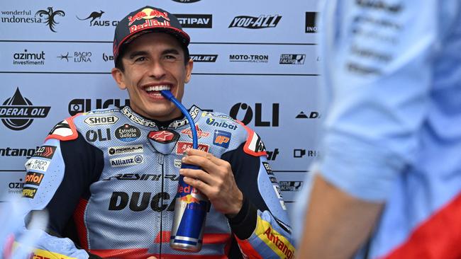 Gresini Racing MotoGP's  Spanish rider Marc Marquez relaxes in the garage as rain cancels the first practice session of the Australian MotoGP on Phillip Island on October 18, 2024. (Photo by Paul CROCK / AFP)