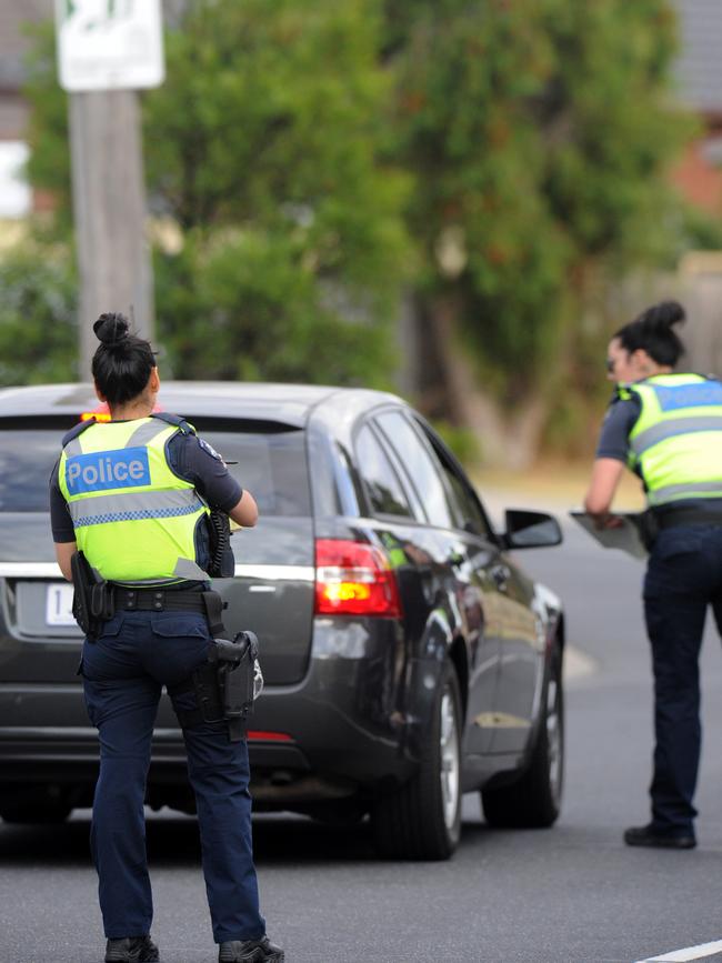 Police at the scene. Picture: Andrew Henshaw