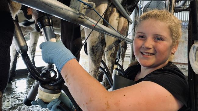 Adeline Matthews helps her dad Brett on their farm at Nambrok, Victoria.