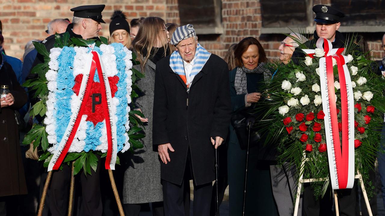 Holocaust survivor Stanislaw Zalewski (C) attends a ceremony at the so-called Death Wall next to the former Block 11 of the former Auschwitz I main camp in Oswiecim, Poland. Picture: AFP