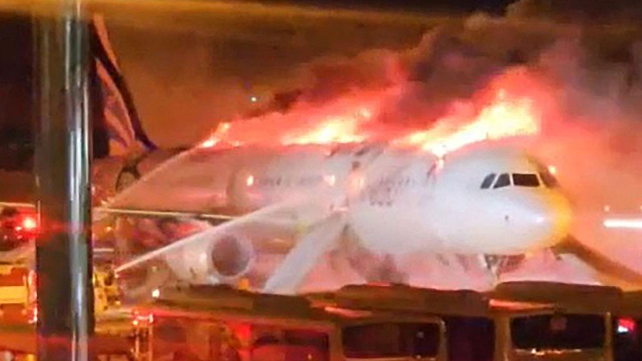 An Air Busan passenger plane caught fire at Gimhae International Airport in South Korea. Picture: YONHAP / AFP