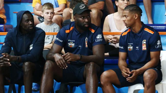 Majok Deng, Nate Jawai and Scott Machado sit on the Taipan's bench together during the National Basketball League (NBL) pre season match between the Cairns Taipans and the Brisbane Bullets, held at Early Settler Stadium, Manunda. PICTURE: BRENDAN RADKE