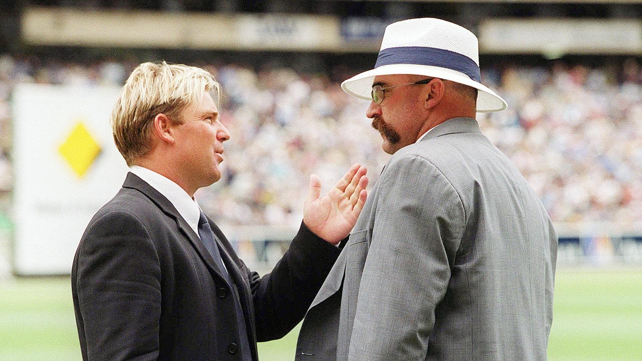 Shane Warne and Merv Hughes chat before a Test at the MCG.