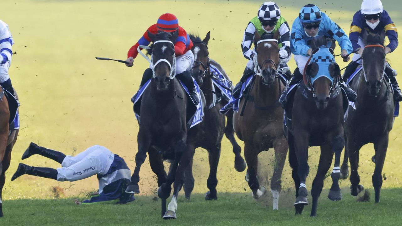 Mo'unga (blue checks) gets the better of Verry Elleegant (red and blue) in the Winx Stakes as Rachel King takes a tumble. Picture: Getty Images