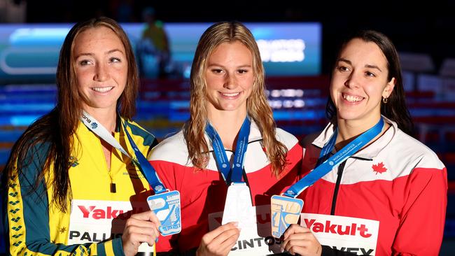 Gold medallist Summer McIntosh of Canada, silver medallist Lani Pallister of Australia and bronze medallist Mary-Sophie Harvey of Canada pose with their medals after women’s 400m freestyle. (Photo by Dean Mouhtaropoulos/Getty Images)